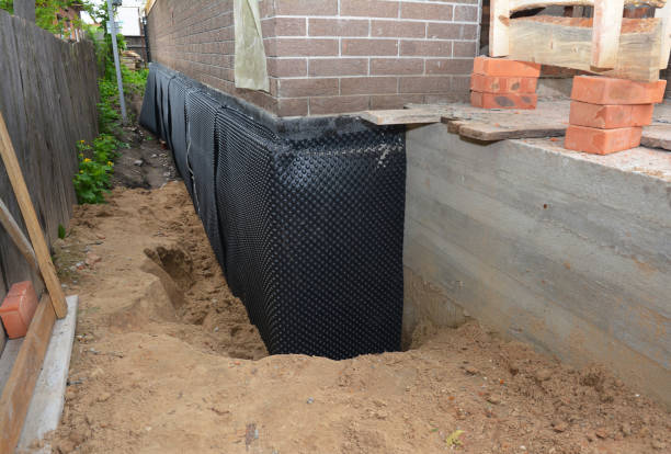 SJ Waterproofing Pros technician performing targeted Emergency Waterproofing assessment in Melbourne, KY